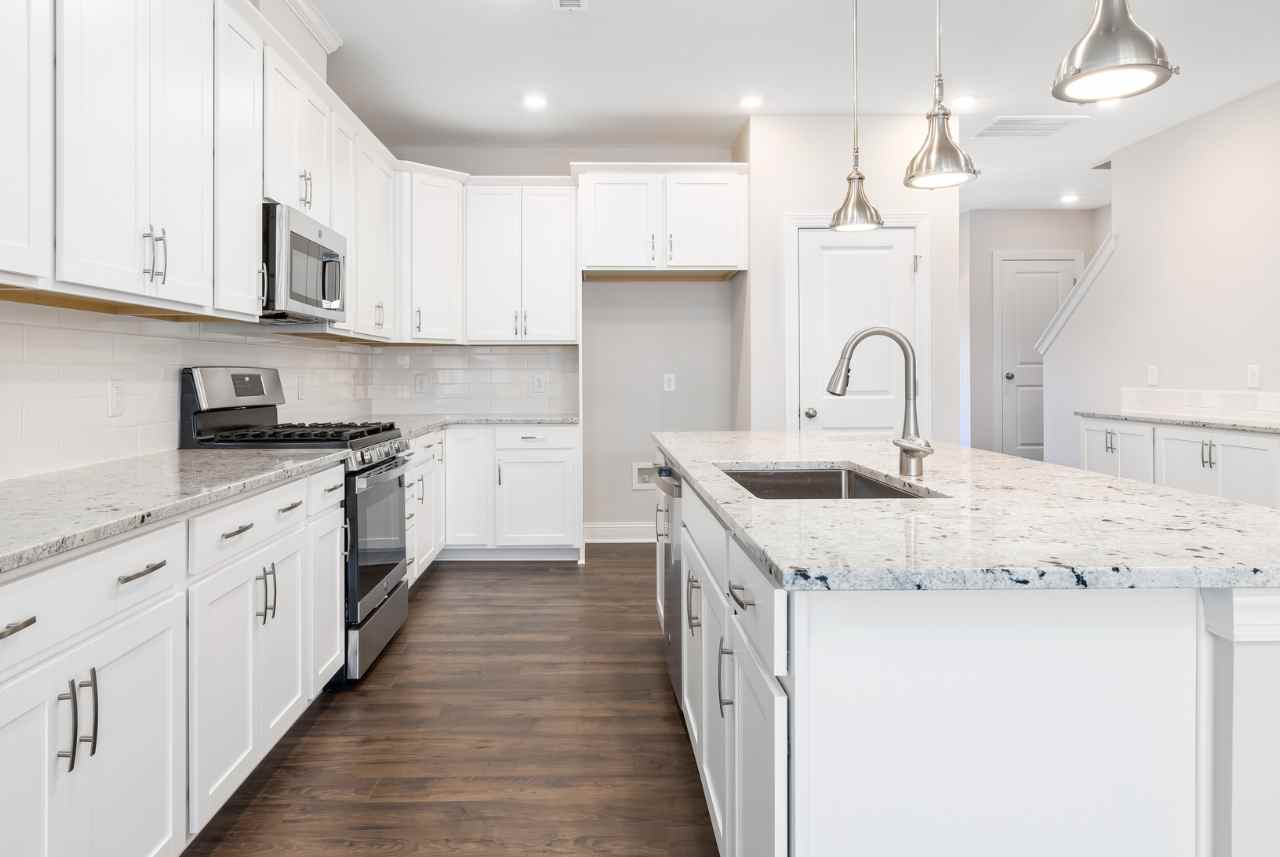 A Granite White Bright Lit Custom Kitchen Cabinets in Milwaukee, Wisconsin