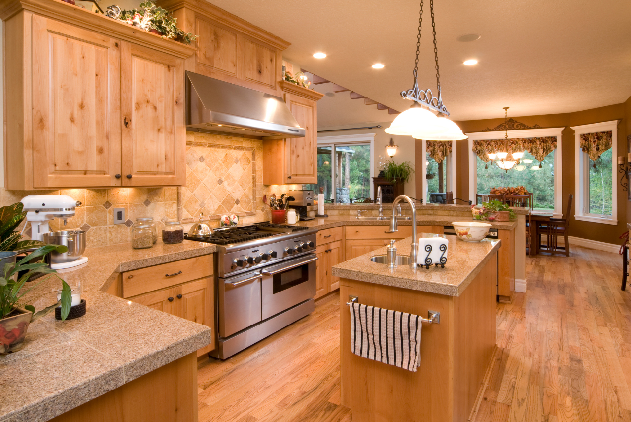 a photo of Custom oak cabinets Spacious kitchen renovation with stainless steal appliances