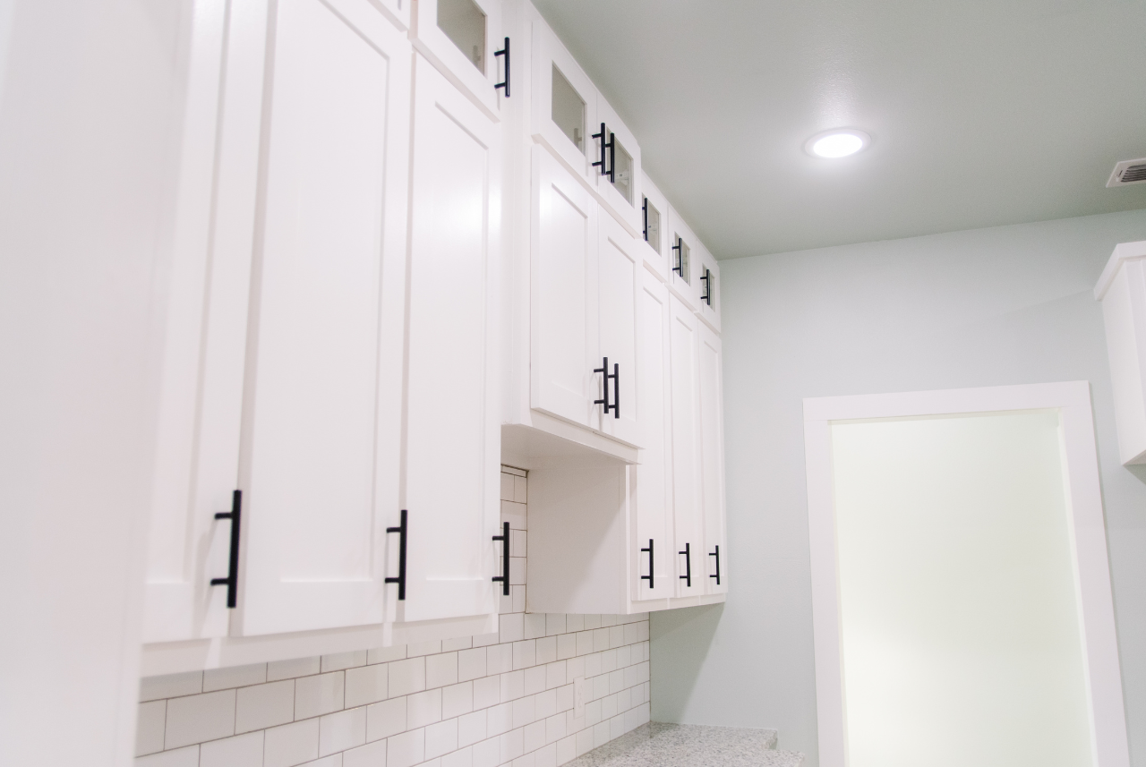 Architectural cabinetry in Waterford, WI, featuring cream and white cabinets.